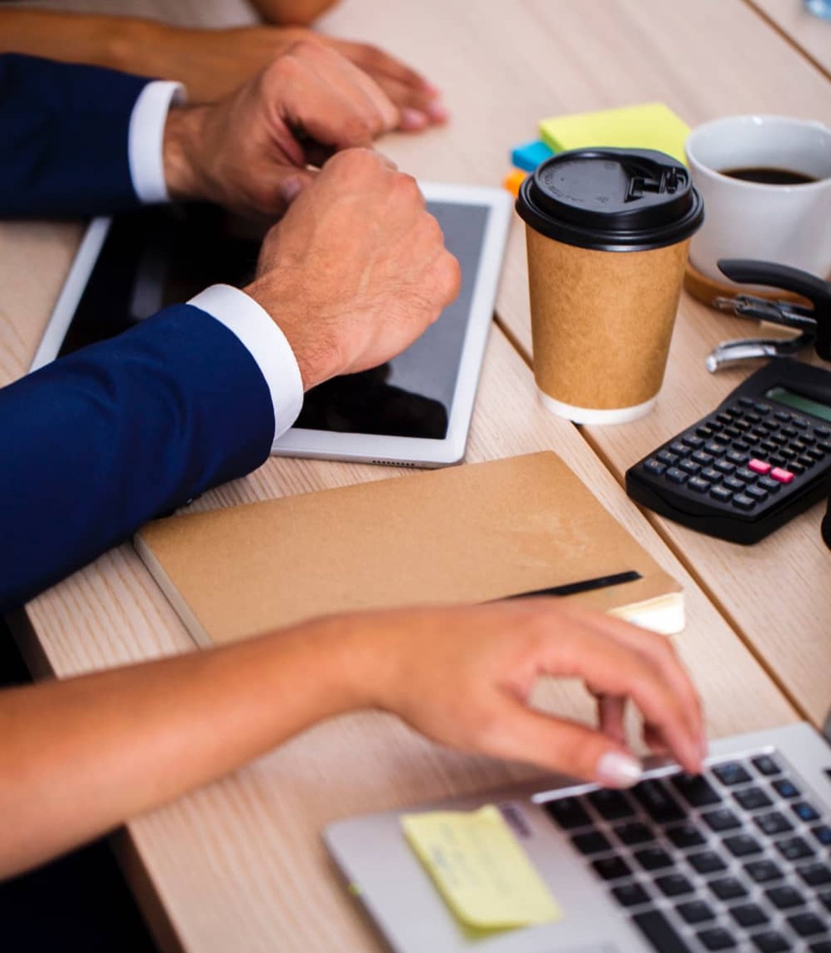 Tax professionals discussing tax minimisation services with a client