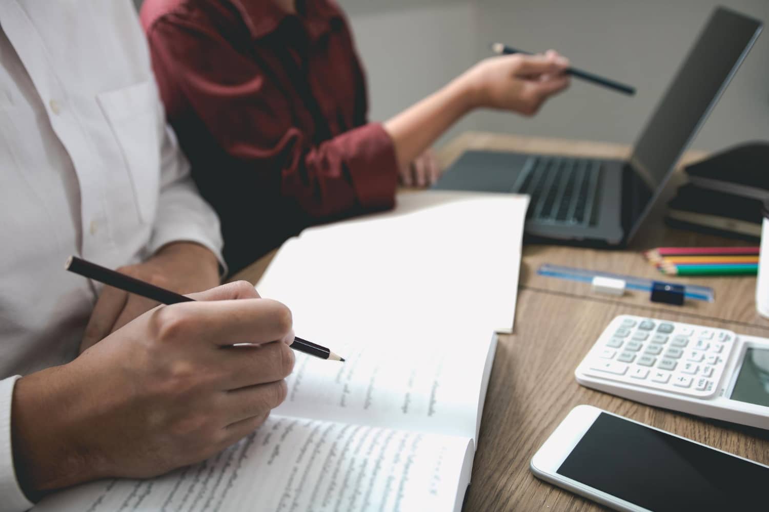 Local tax agent assisting client with tax compliance documents